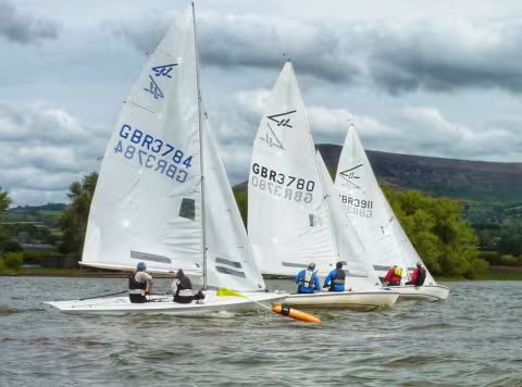 Sheeting-in on the start-line. David Morgan and Lorina Walden (3780) are already powering on. Flying Fifteen Open Meeting 2025